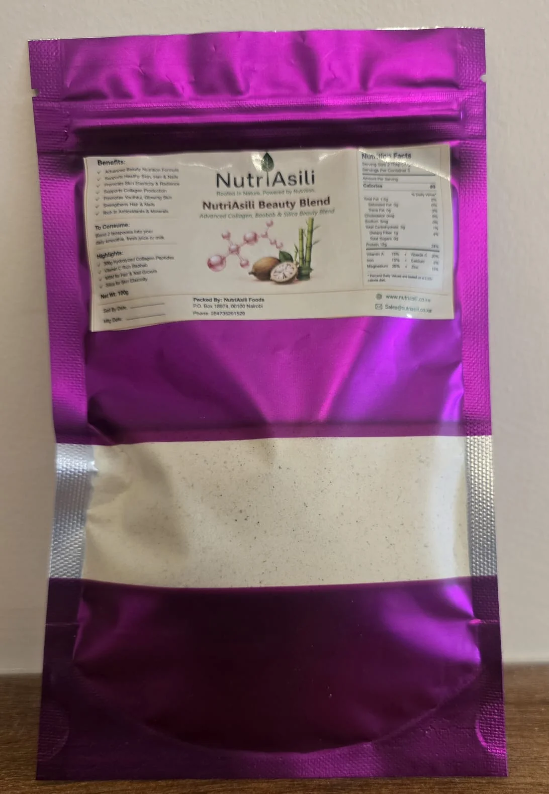 Natural organic food ingredients including fresh vegetables, fruits, and herbs on a wooden table